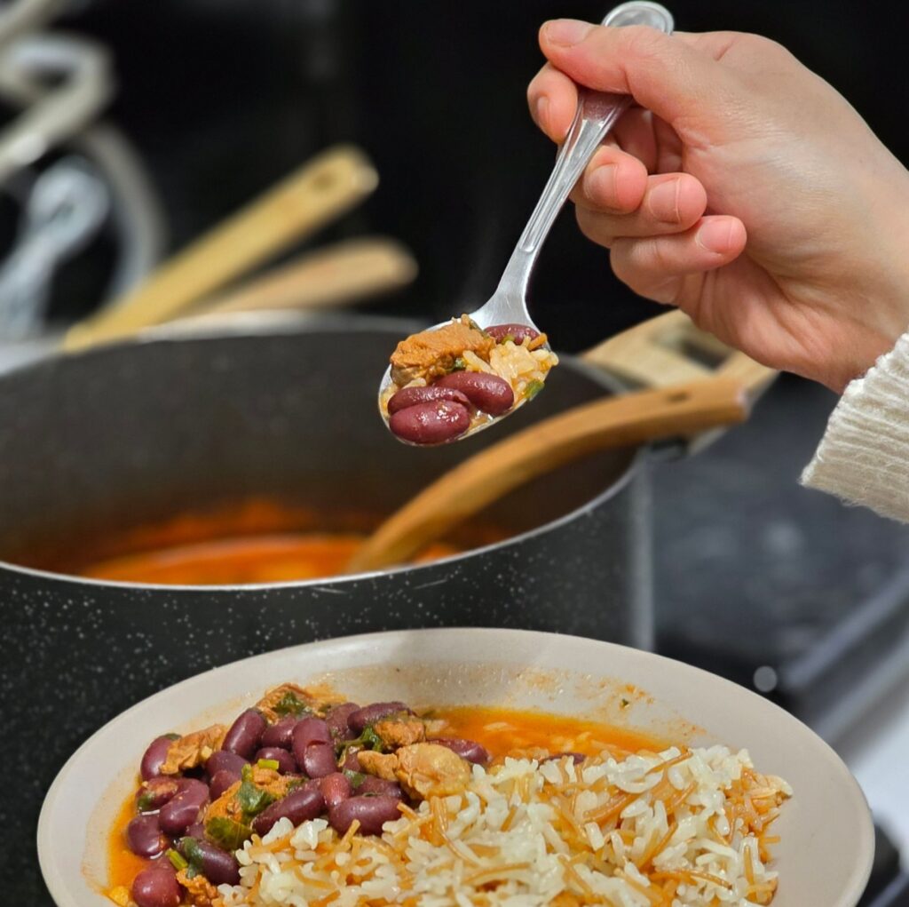 Spoon serving beans from a bowl
